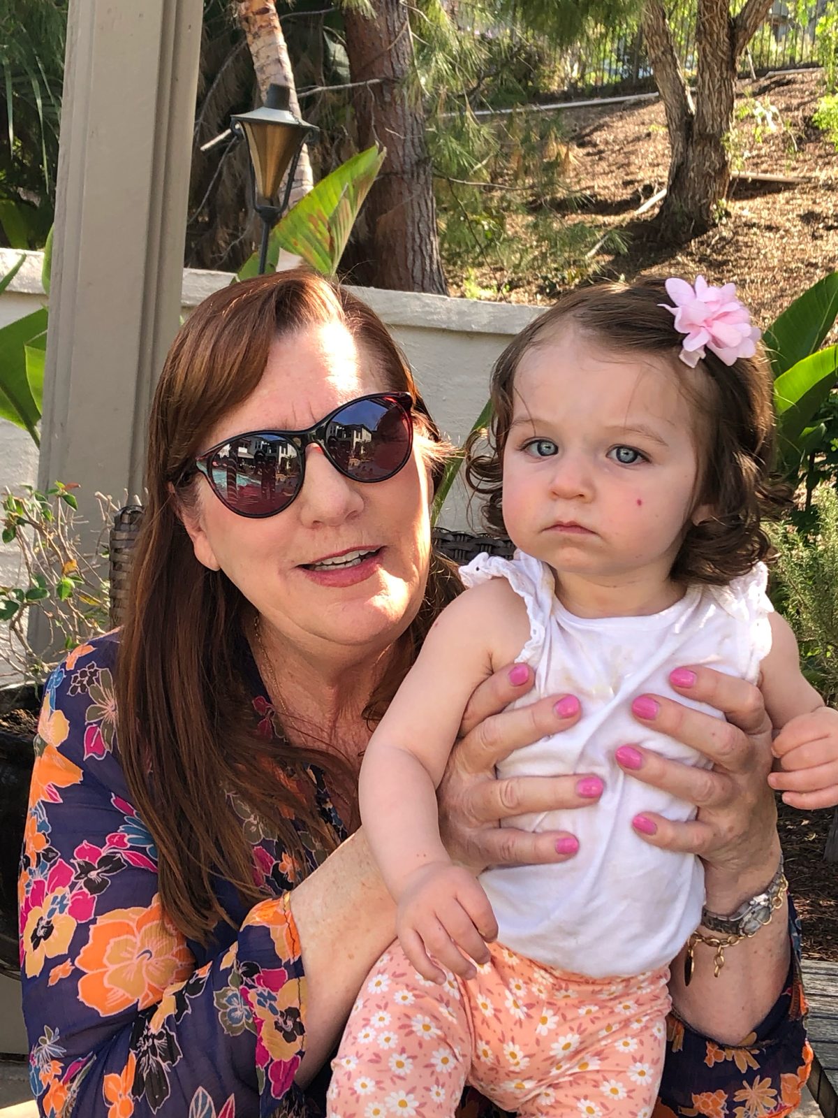 Kathy holding one of her grandchildren